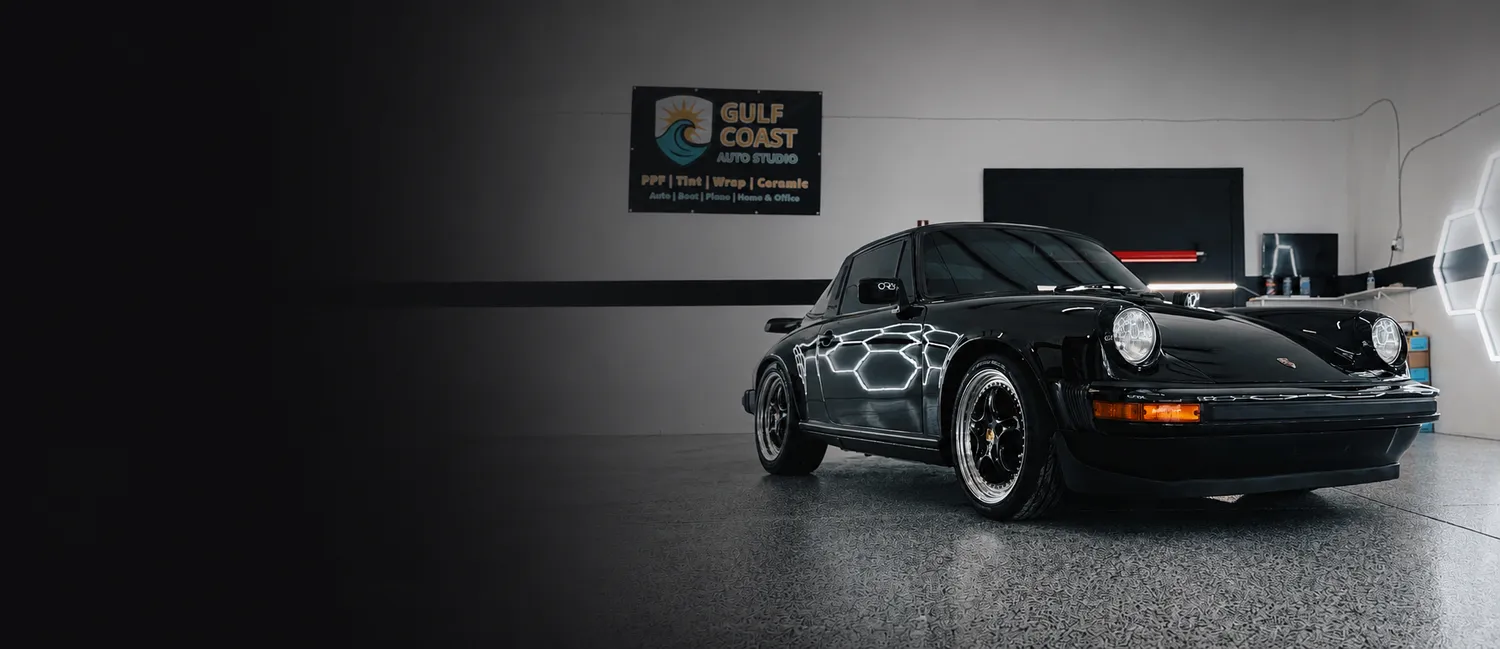Porsche 911 inside the Gulf Coast Auto Studio bay in Sarasota